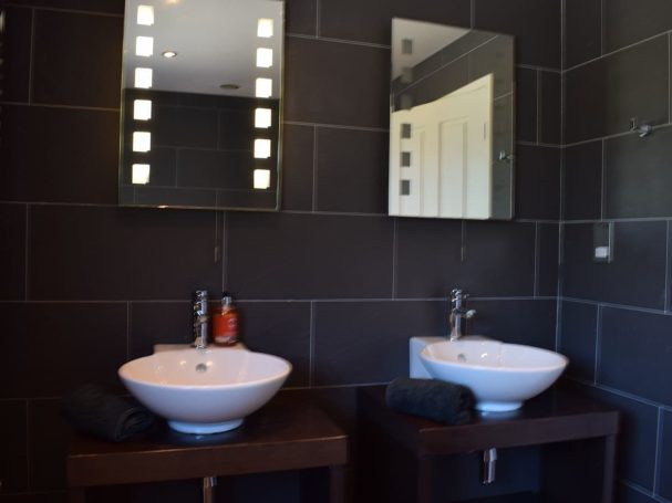 "Spacious bathrooms with double sinks,  constant hot water "