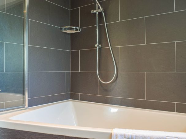 "Spacious bathrooms with double sinks,  constant hot water "