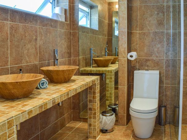 "Spacious bathrooms with double sinks,  constant hot water "